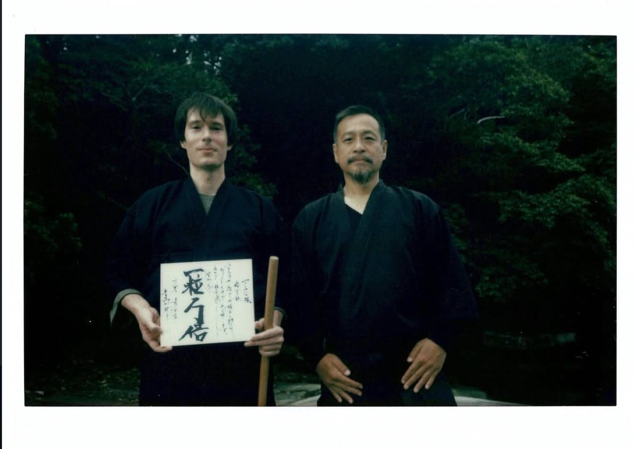Mansur Kohaku receiving the named scroll from sensei Zen Takai